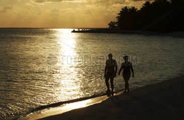 Maldives  couple walking in the twilight
