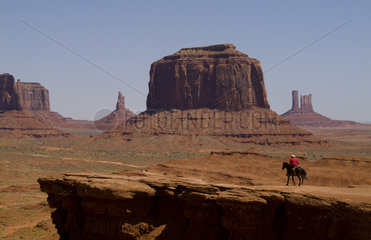 Monument Valley Utah with mittens and great Cherokee Indian on horse as guide in National Park USA