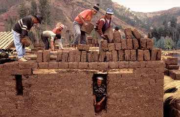 Peru  Cusco region; Use of adobe stones  a mix of clay  sand and small stones; the traditional construction material for building houses.