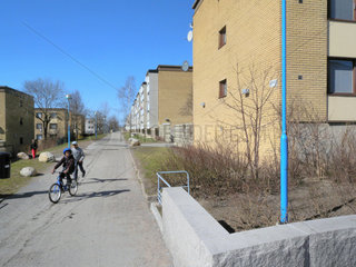 STOCKHOLM SWEDEN Rinkeby. Primarily immigrant suburb. Kids on bikes __Alex Farnsworth