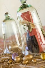 Easter egg and chocolat in a bell jar