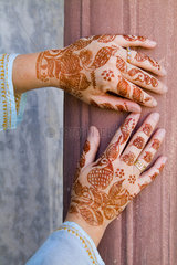 Colorful Henna design on womans hands artwork for celebration tatoos in Delhi India