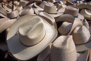Hats for sale in outdoor market  Mexico. Latin America  trade  trading  commerce  market  market-places  marketplaces  outdoor-market  hat  many hats  straw hats  culture  cultural traditions