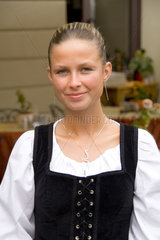 Close up of beautiful waitress in costume of tourist city of Cesky Krumlov in Czech Republic