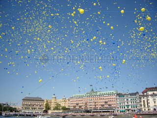 STOCKHOLM SWEDEN On June 6  Swedens national day  50 000 blue and yellow balloons (colors of the Swedish flag) and biodegradeable balloons were released over town. __Alexander Farnsworth