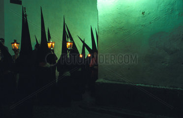Jerez de la Frontera during the holy week of Eastern hooded processions pass through the night