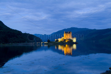 Beautiful Eileen Donan Castle in Western Dornie in Highlands os Scotland the most photographed castle in the world at night with reflections on still beautiful waters