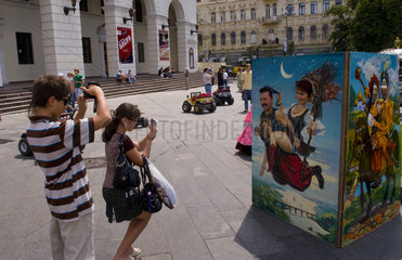 Familtyh having fun at attraction in street festival in Kiev Ukraine