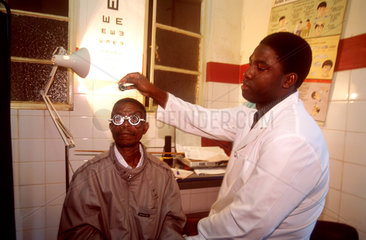 Man having his eye sight tested by the ophthalmologist. Chimoio provincial Hospital. Manica. Mozambique