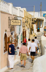 Oia Santorini Greece and the relaxed vacation with shoppers on main streets