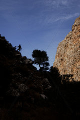 Crete  silhouette of a tourist hiking in the valley of the dead near Kato Zakros