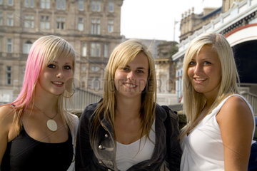 Beautiful modern blonde teenage girls on street in beautiful Edinburgh Scotland