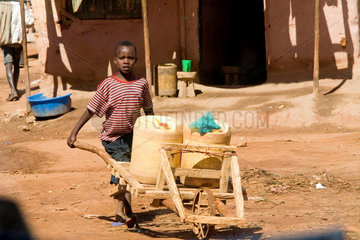 little child transports water