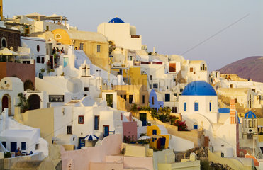 Santorini Greece and the beautiful white buildings on the mountain cliffs of the small isolated roamntic city of Oia