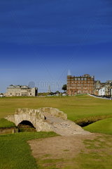 Golfing the special Swilcan Bridge on the 18th hole at the world famous St Andrews Old Golf Course Scotland