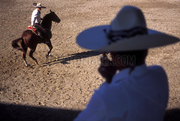 Charreria ( Kind of rodeo )  Instalaccion de Charros at Orendain factory  Tequila city  Mexico. Cowboy  cowherd  herdsman  horse  hat  culture  cultural traditions  Latin America