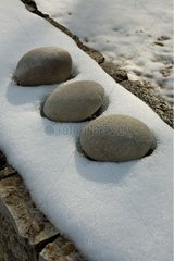 Stones laid on the snow in Provence