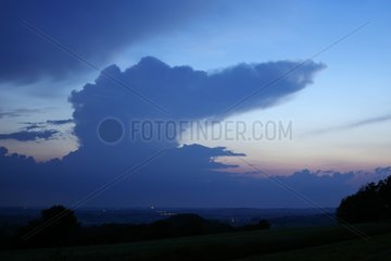 Isolated cumulonimbus clouds at dusk in the spring France