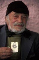 Calcata  Paolino (72) shows a picture of himslef as a young man