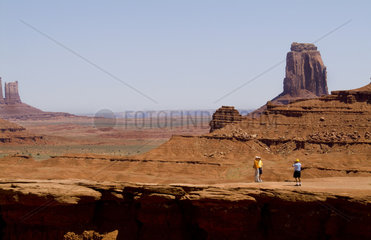 Monument Valley Utah with mittens and tourists taking pictures in National Park