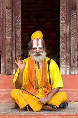 Religious Hindu costumed man in Durbar Square in center of village of Kathmandu Nepal