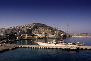 Port harbour of Kusadasi with ship in beautiful water in Turkey