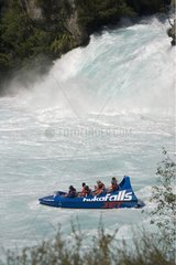 Tourists in Huka Falls jet boat on Waikato River