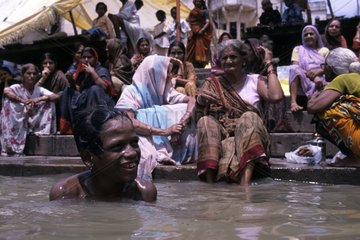 Young Indian bathing in Gange Varanasi India
