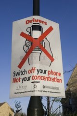Signboard warning not to use mobile phones whilst driving