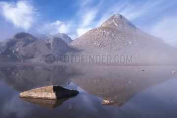 Mountains reflecting on the Sageroux Lake Haute-Savoie