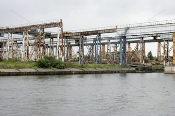 Storage of wood waiting to unload river Russia