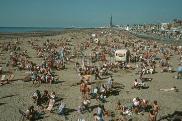 Holidaymakers enjoying sunshine on Blackpool Sands UK