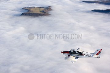 Plane flying above a clouds sea Germany
