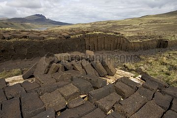 Peat cutting with blocks drying Isle of Skye Scotland