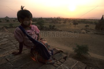 Young girl at the top of a temple of Bagan Myanmar