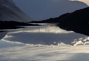 Reflections in a mountain lake Area of Jotunheim Norway