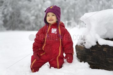 Girl happy playing with snow France