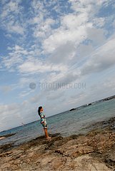 Woman next to the coast in Formentera Balearic Islands