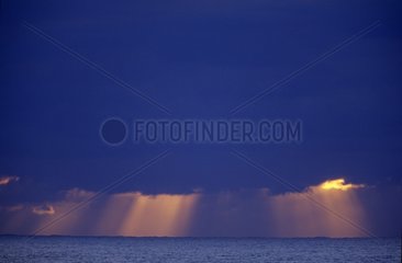 Sunbeam through the clouds on the sea Australia