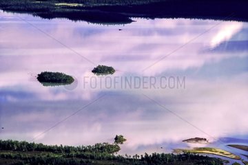 Clouds reflected in the lake and taiga Sarek Lapland Sweden
