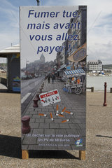 Information panel on the price of fines for the lack of respect for cleanliness in town at Treport  Normandy  France