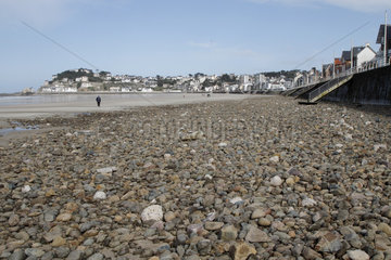 Absence of sand due to a storm that swept everything to reveal only the pebbles in Val-Andre  Brittany  France