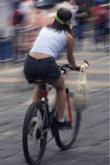 Woman biking in the city of Quito Ecuador