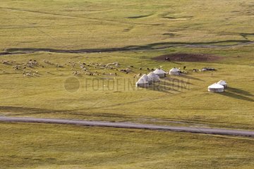 Nomadic breeders and yurts in the steppe Kyrgyzstan