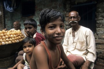 Child and his family in a street of Calcutta India
