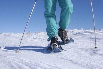 Hiker with rackets on snow Plateau de l'Aubrac