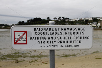 Information panel about bathing and shellfish harvesting on Saint-Pol-de-Leon beach  Brittany  France