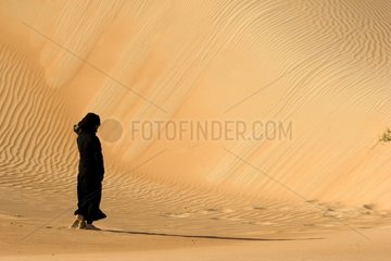 Bedouin in the dunes Abu Dhabi United Arab Emirates