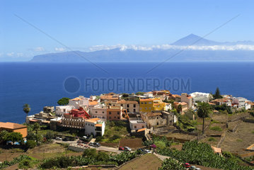 Village of Agulo with the Teide (Tenerife) in the background  Island of La Gomera  Canary Islands.