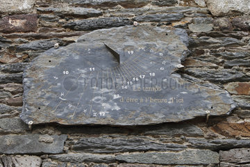 Slate solar clock on the facade of a house in La Gacilly  Brittany  France